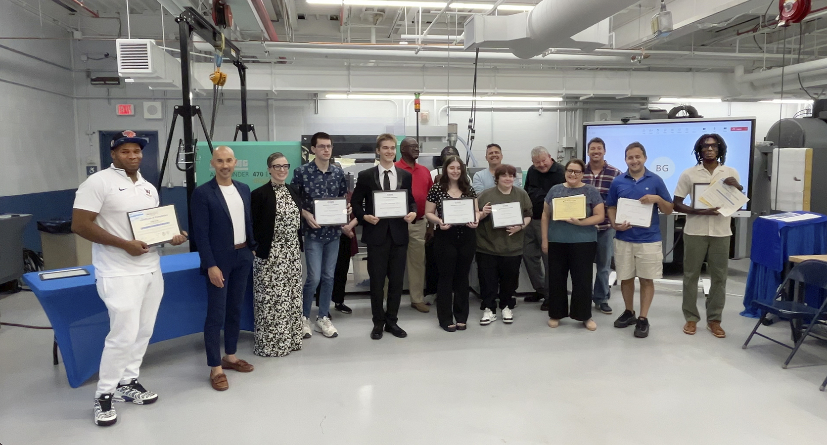 Students cpictured holding awards for completion of Skill Up for Manufacturing training program