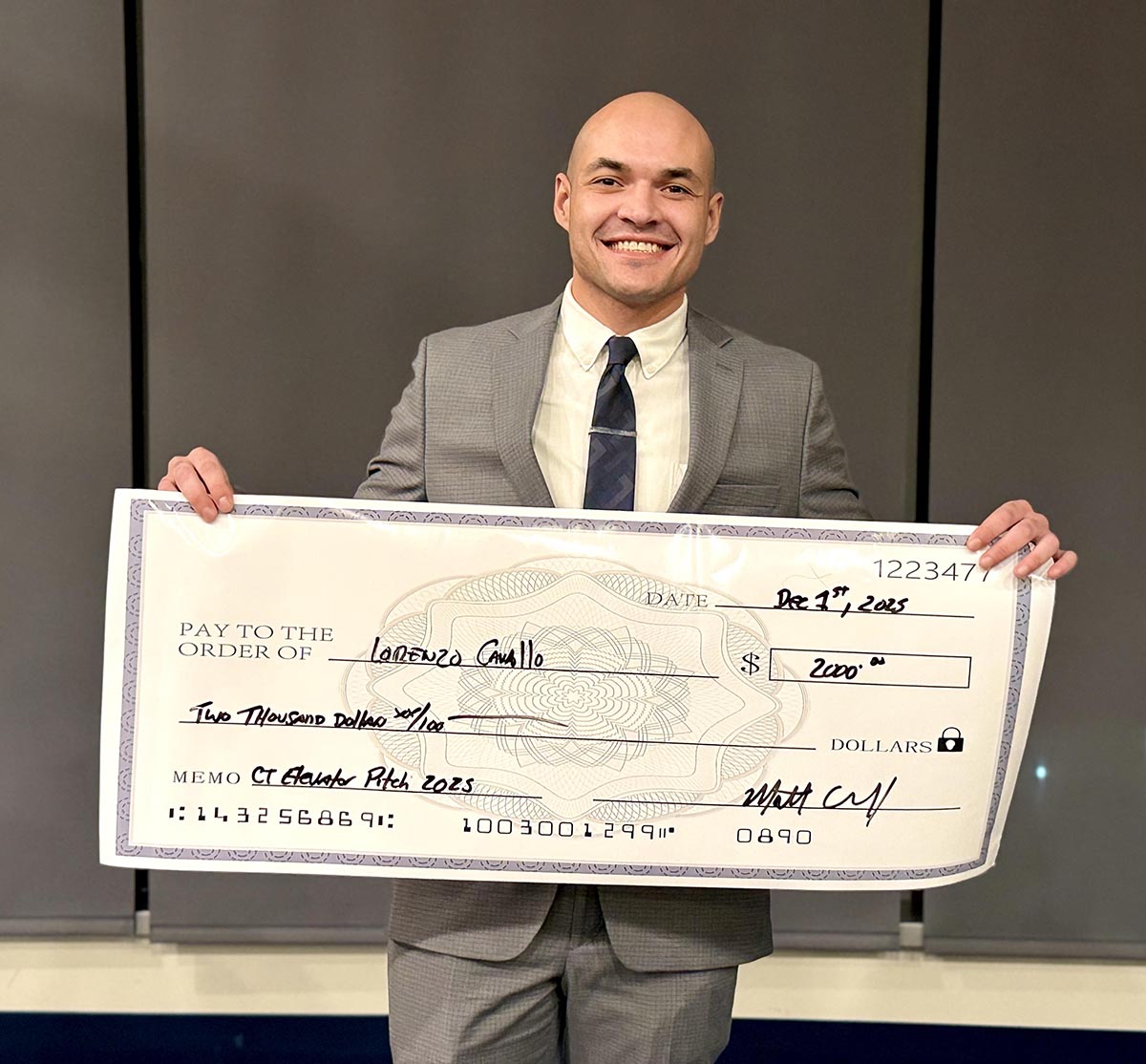 Lorenzo Camillo receives a $2,000 for his work in the competition