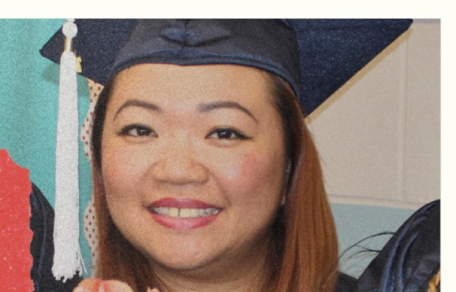 Asian woman smiles into camera wearing a graduation cap.