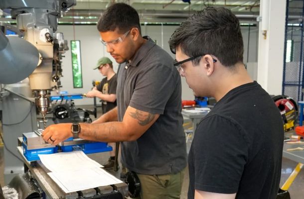 Manufacturing students work on a milling machine at the CT State Tunxis Advanced Manufacturing Technology Center in Farmington. Credit: Contributed CSCU