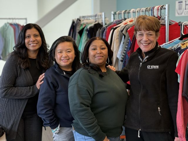 CT State students browse professional clothing on racks in the campus Career Closet, a program that provides free attire for interviews and workplace preparation.