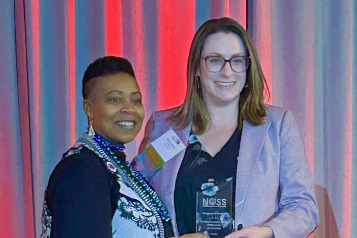 Rachel Jasiczek, Ph.D., CT State's Writing Across the Curriculum program coordinator (right), accepted the award from NOSS President Glynis Mullins on Saturday.