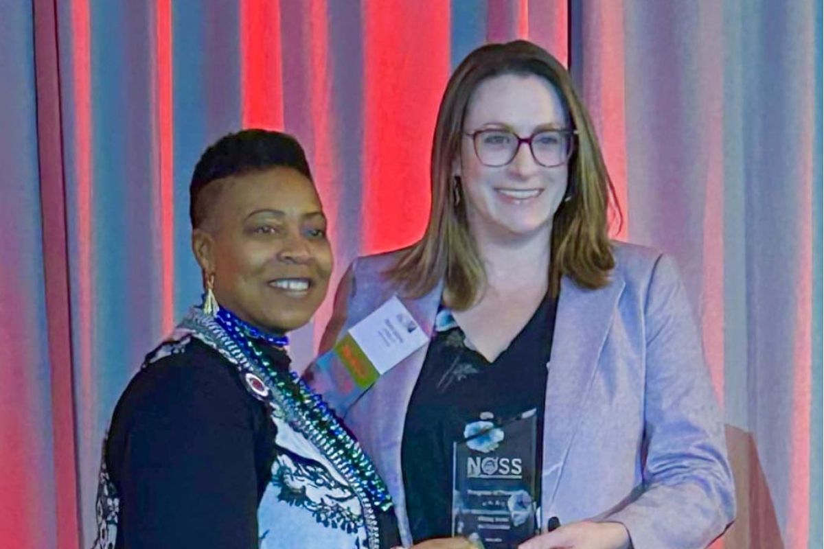 Rachel Jasiczek, Ph.D., CT State's Writing Across the Curriculum program coordinator (right), accepted the award from NOSS President Glynis Mullins on Saturday.