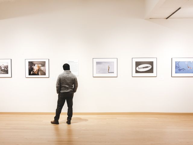 A person is looking at artwork at the Housatonic useum of Art