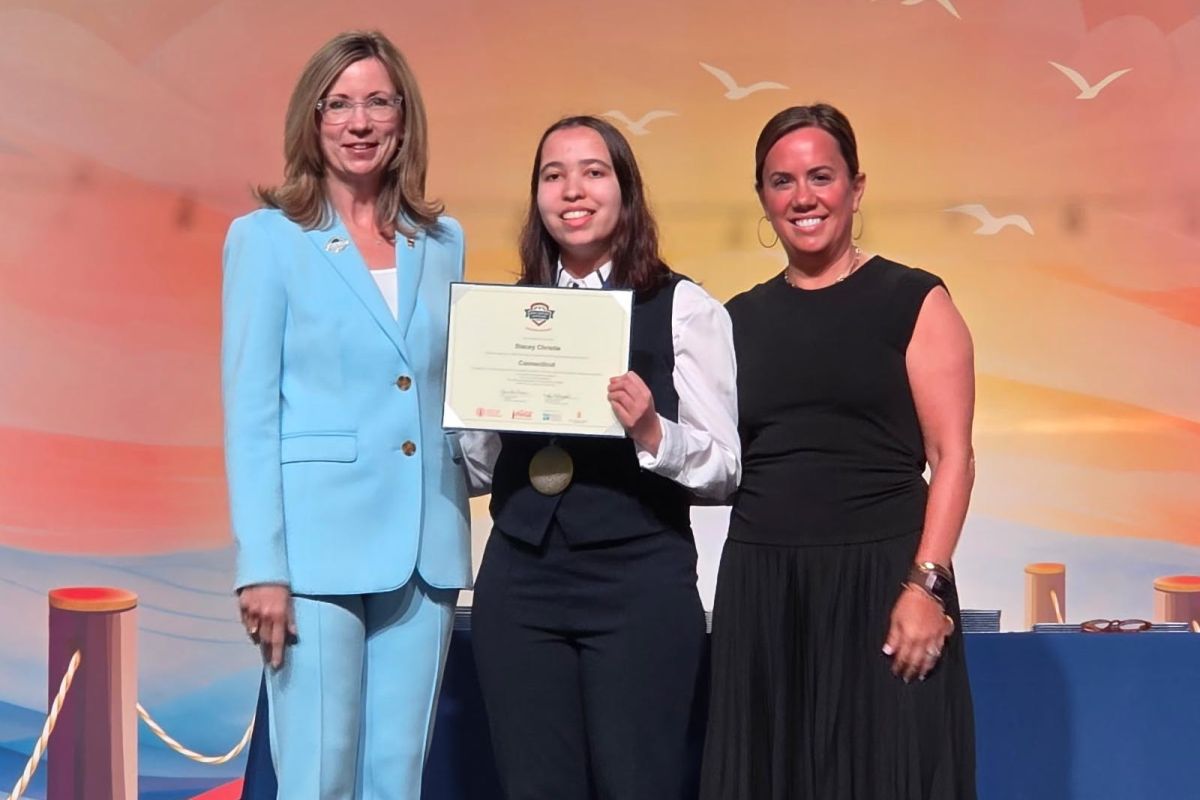 Chair of the Board of Phi Theta Kappa Dr. Monica Marlowe (l), and President of Coca-Cola Scholars Foundation, Jane Hale Hopkins, presented CT State Asnuntuck student Stacey Christie with a New Century Transfer Scholar award