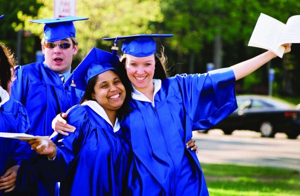 Graduates pose for a photo