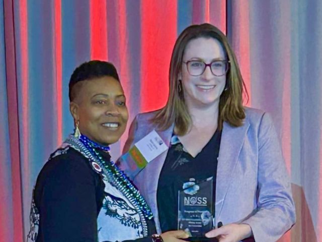 Rachel Jasiczek, Ph.D., CT State's Writing Across the Curriculum program coordinator (right), accepted the award from NOSS President Glynis Mullins on Saturday.