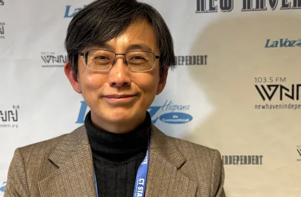 Sorry, Claude: Prez Wang (pictured at WNHH FM) has the job covered. Credit: Paul Bass Photo