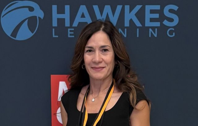 Marta smiles wearing her award