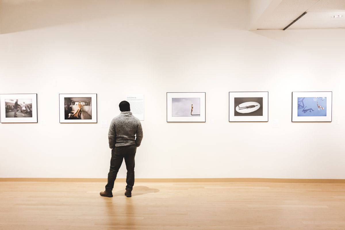 A person is looking at artwork at the Housatonic useum of Art